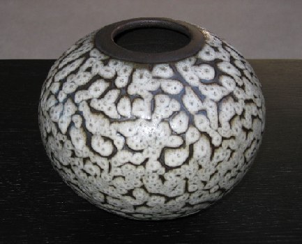 Lava sphere, white lava glaze over black slip on stoneware clay, d: 180mm
